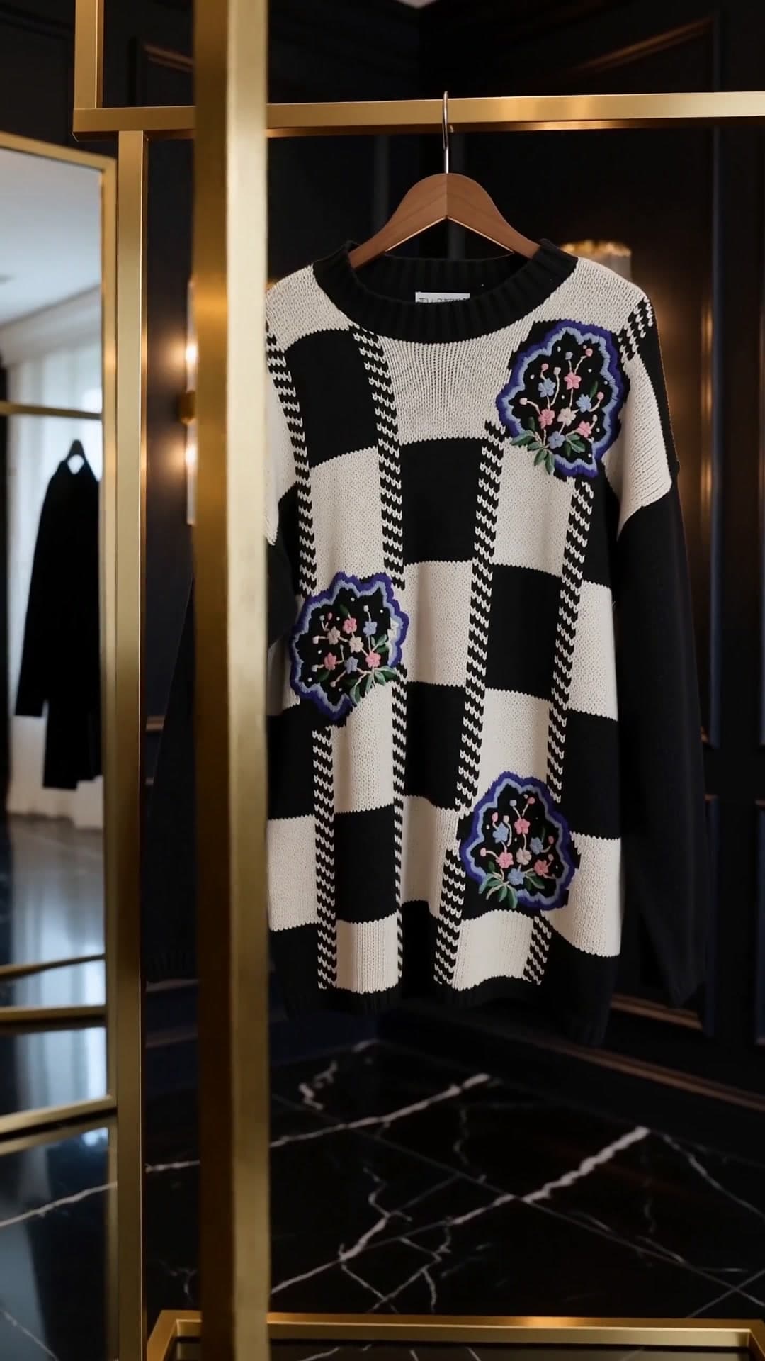 Floral check knit on a gold rail in the boutique