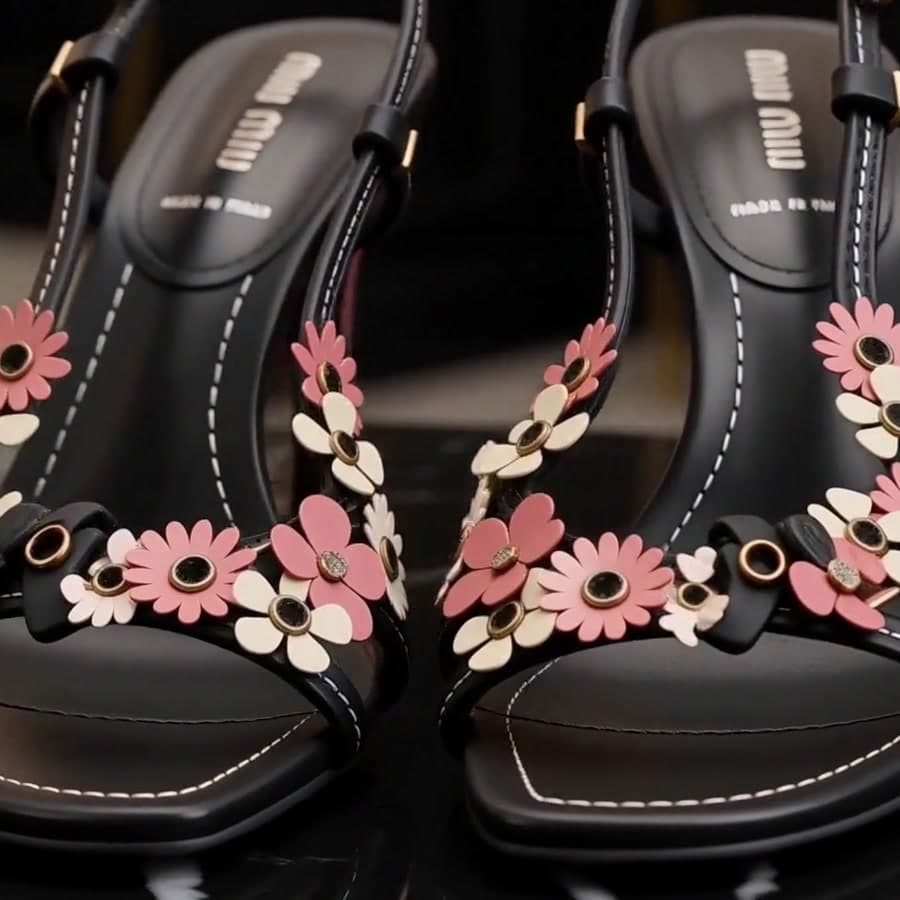 Detail of floral appliqué on a sandal